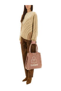 A dusty rose marant tote bag with textured fabric and white embroidered logo shown with isabel marant étoile beige sweater