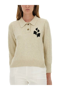 Beige knitted polo sweater by Isabel Marant Étoile with black embroidered leaf motif and gold-tone buttons