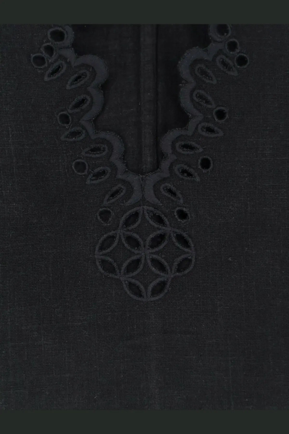 Black linen top by Isabel Marant Étoile with intricate embroidered detailing around the neckline