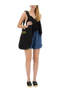 Isabel Marant Étoile women’s black woven tote bag with gold lettering matching short ipolyte blue design