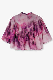 A pink and purple tie-dye cropped cape with a pleated flared silhouette paired with isabel marant étoile veelia organic cotton blue shirt