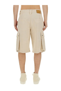 Beige cargo shorts with multiple pockets and leather brand patch at waistband from Isabel Marant men’s bermuda tejelo pink collection
