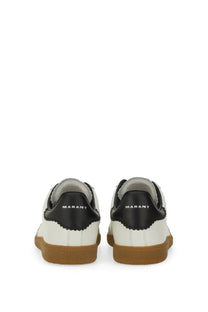 White and black leather isabel marant men’s brycy sneaker with tan rubber sole and marant logo on the heel back side