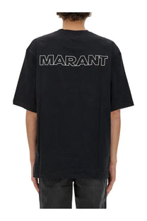 Black oversized isabel marant men’s guizy shirt showing bold white marant lettering across the back