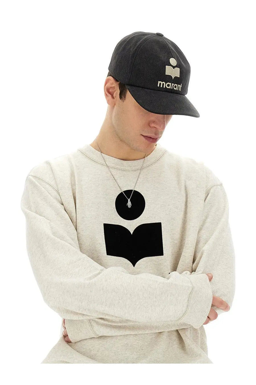 Black marant cap with white logo and embroidered text paired with isabel marant men’s mikoy pink sweatshirt