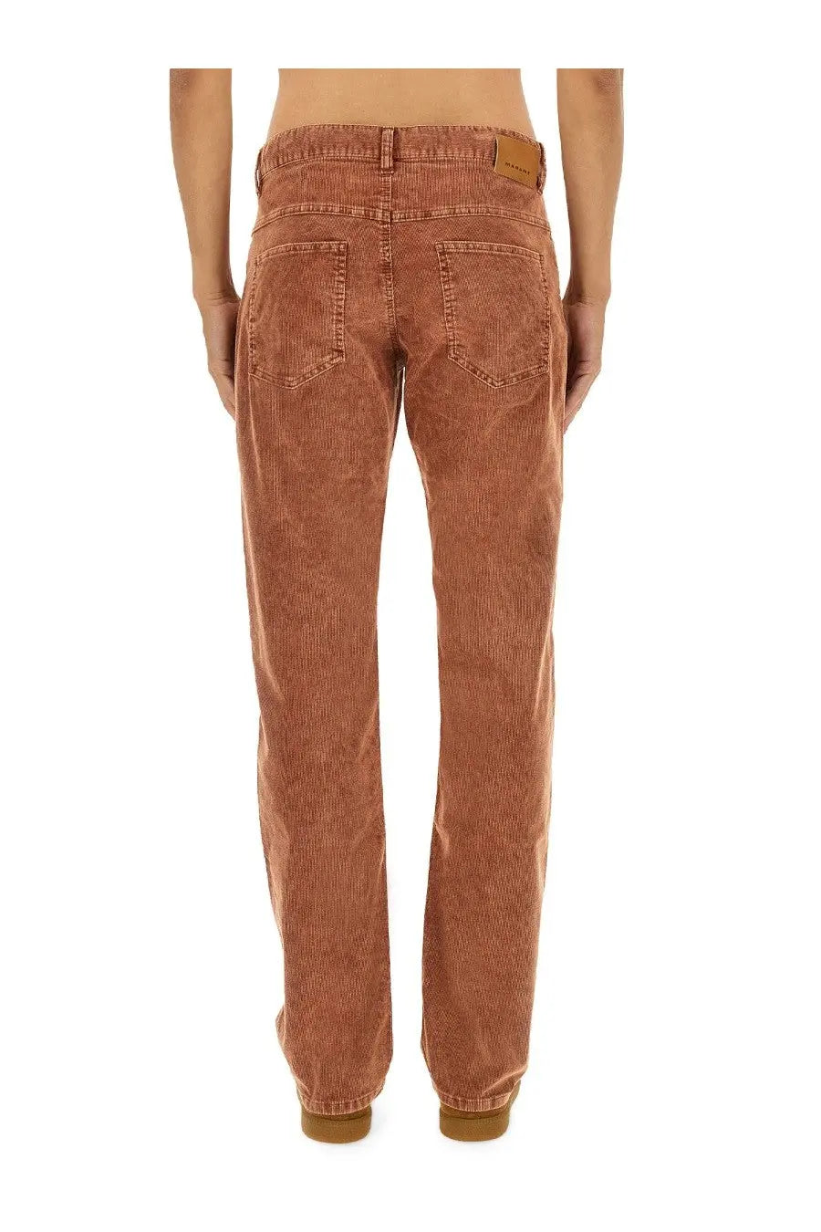 Isabel Marant men’s corduroy trousers in warm terracotta with vertical ribs and classic back pockets shown from the back