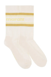 Isabel Marant men’s cream-colored socks with gold ribbed stripes and a subtle yellow logo in pink packaging