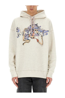 Cream-colored oversized hoodie featuring a vibrant graphic of a stylized figure with flowing blue and purple hair