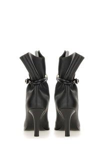 Isabel Marant women’s black leather ankle boots with sleek high heel and decorative buckle detail visible from the back