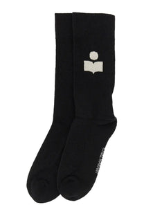 Isabel Marant women’s black crew socks with white embroidered logo of a figure holding an open book