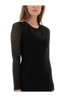 Isabel Marant women’s black long-sleeved knit dress with sheer patterned mesh overlay on arms and torso