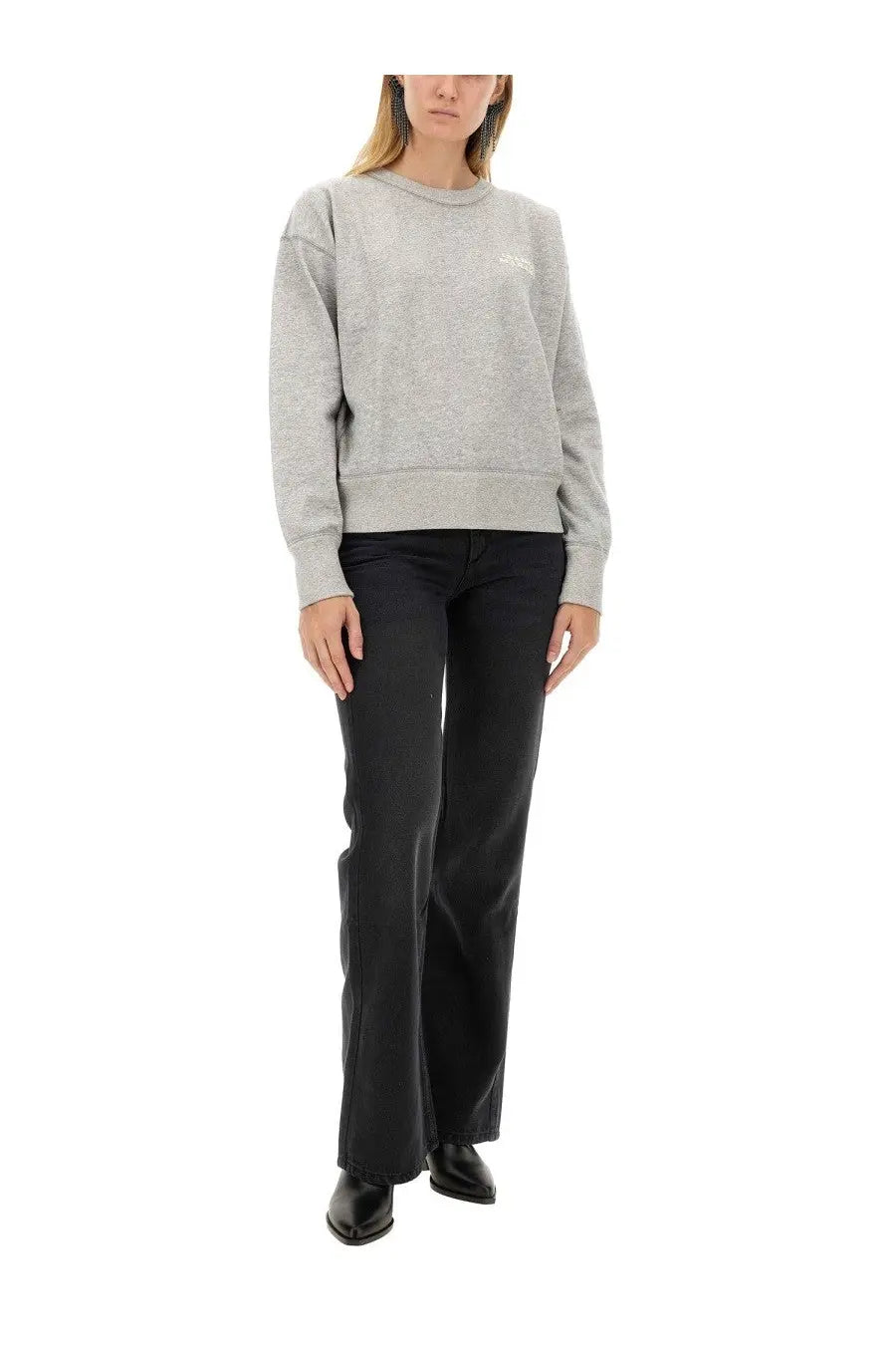 Isabel marant women’s jeans belvira black paired with a gray textured knit sweatshirt featuring a subtle white logo