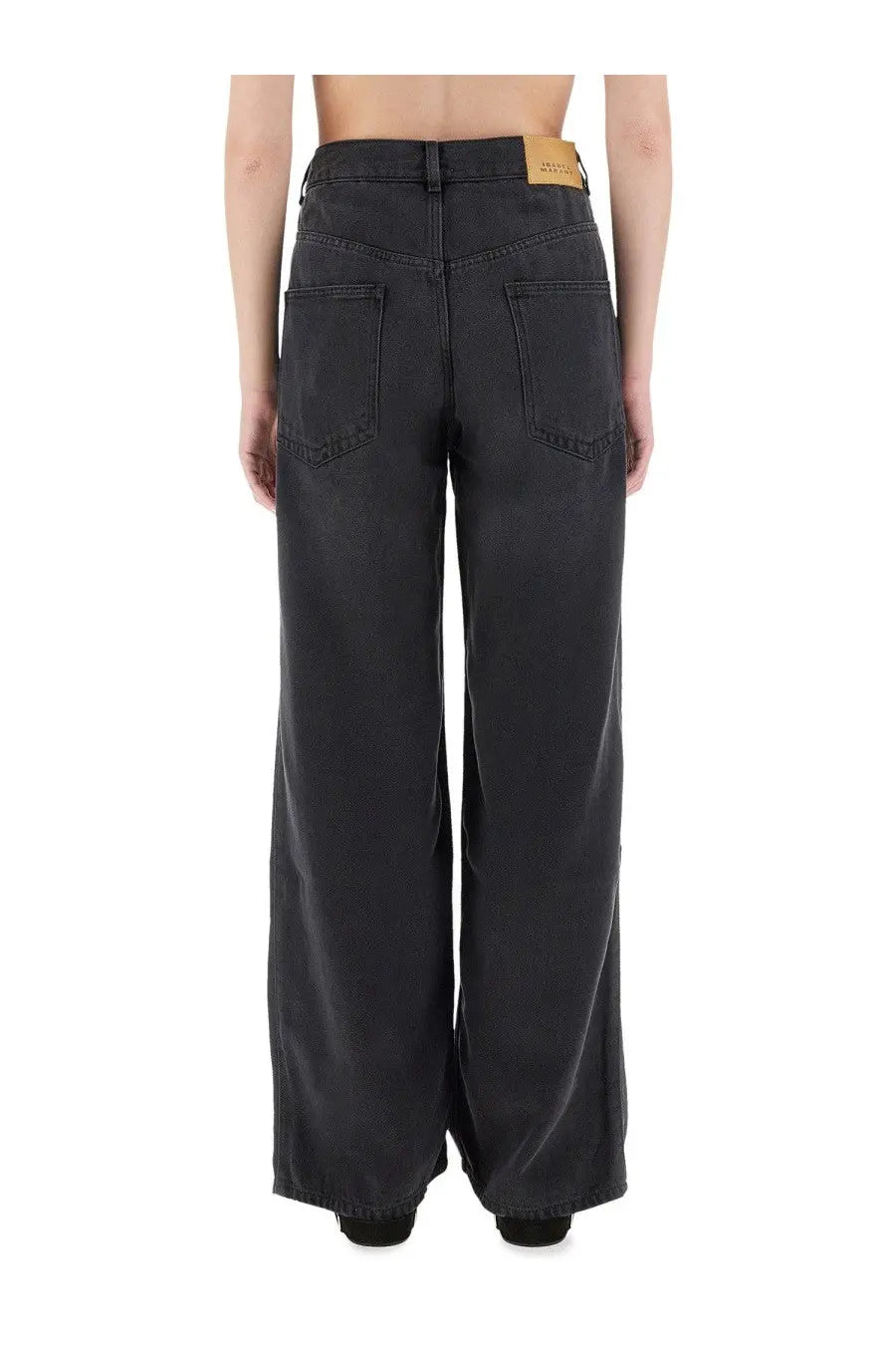Back side of Isabel Marant women’s black wide-leg denim jeans with high waist two back pockets and tan leather label