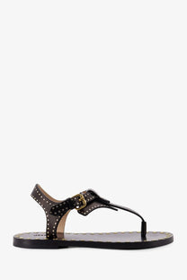 Isabel Marant women’s Joonya low black leather thong sandal with gold-tone studs and matching buckle visible from the back
