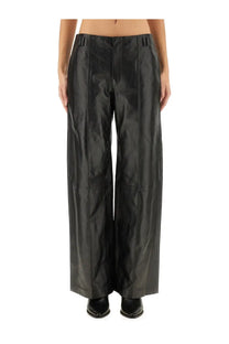 Isabel Marant women’s black faux leather wide-leg trousers with glossy finish and clean vertical seams front view