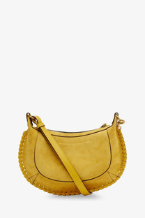 Isabel Marant women’s oskan moon crossbody bag in mustard yellow suede with braided leather trim and gold-tone hardware
