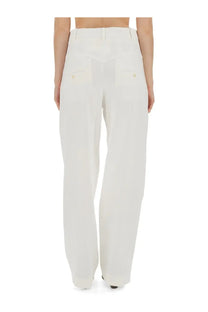 Isabel Marant women’s white high-waisted wide-leg trousers with tailored design and buttoned back pockets shown from back
