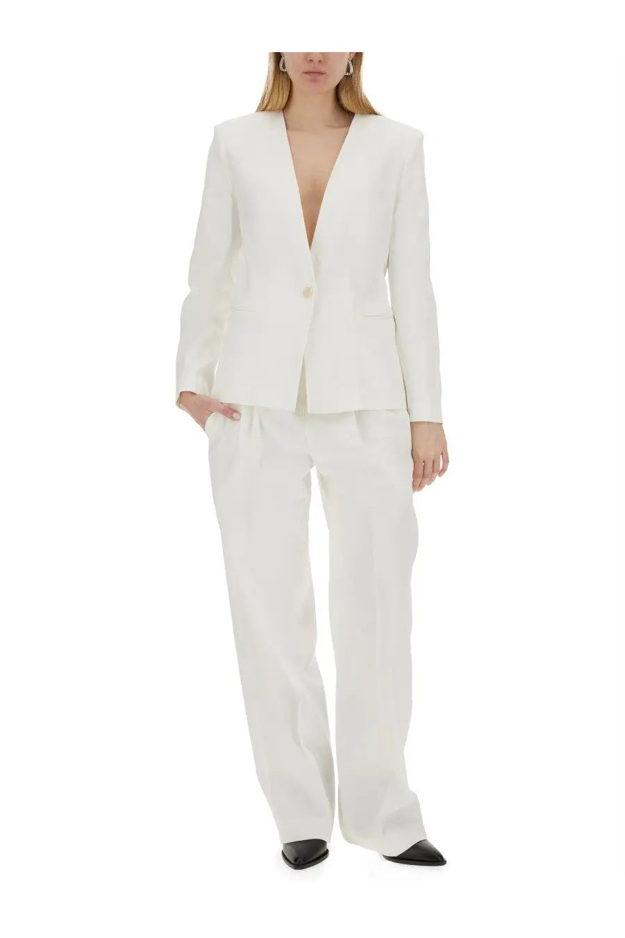 White tailored blazer with single button and structured shoulders paired with isabel marant women’s pants staya white wide-leg trousers