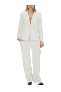 White tailored blazer with single button and structured shoulders paired with isabel marant women’s pants staya white wide-leg trousers