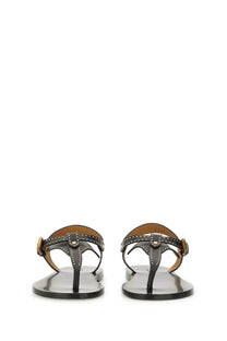 Isabel Marant women’s black leather thong sandals with gold-tone buckle and silver studs front view