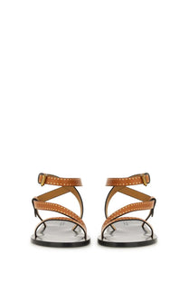 Isabel Marant women’s tan leather sandals with gold-tone studs and black rubber soles in brown jopee style