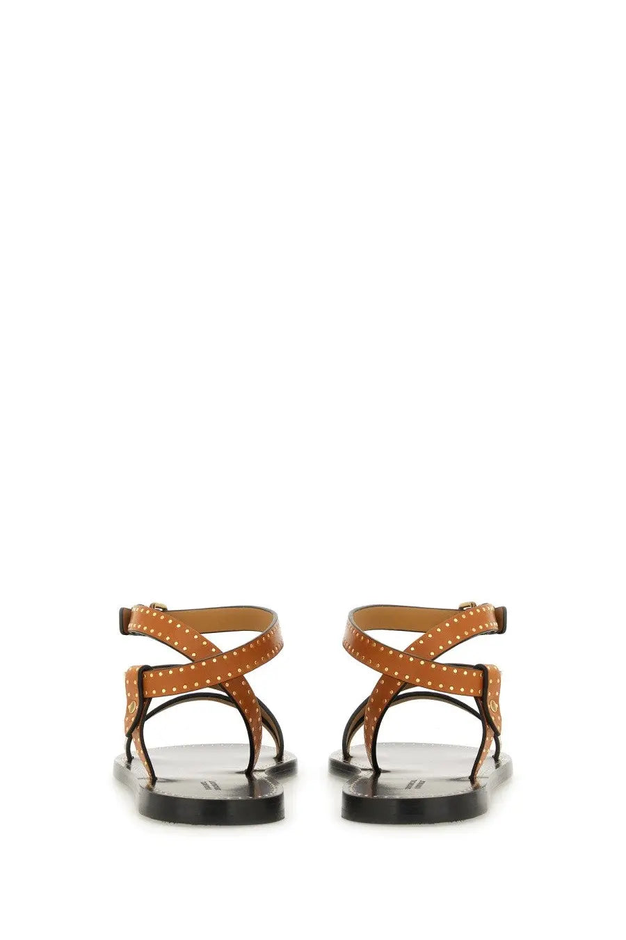 Isabel marant women’s tan leather sandals with gold-tone studs and black rubber soles shown from the back