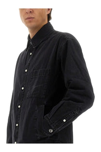 Jacquemus men’s black denim button-up shirt with white buttons and subtle embroidered logo on chest pocket