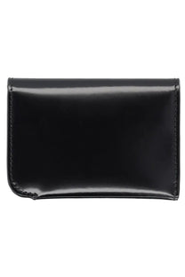 Jacquemus men’s curved wallet in black patent leather with precise edge stitching visible in the image
