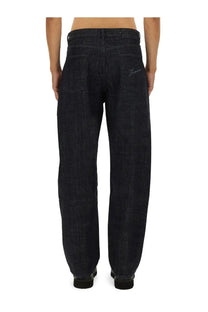 Jacquemus men’s the de nimes mirada pant in dark indigo denim with relaxed wide-leg cut and subtle stitching details