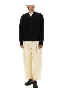 Jacquemus men’s black knit double cardigan with silver buttons showcasing a stylish layered design