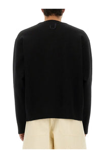 Black jacquemus men’s double cardigan knit sweater with long sleeves and subtle logo at neckline