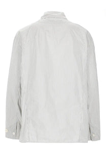 A relaxed-fit long-sleeved jacquemus giacca la veste boutis shirt in light gray and white vertical stripes