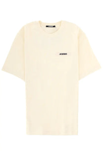 Jacquemus men’s beige oversized cotton t shirt with minimalist black logo patch on chest and matching neckline label