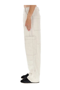 Jacquemus men’s beige wide-leg cargo pants with multiple patch pockets and visible stitching in cream color