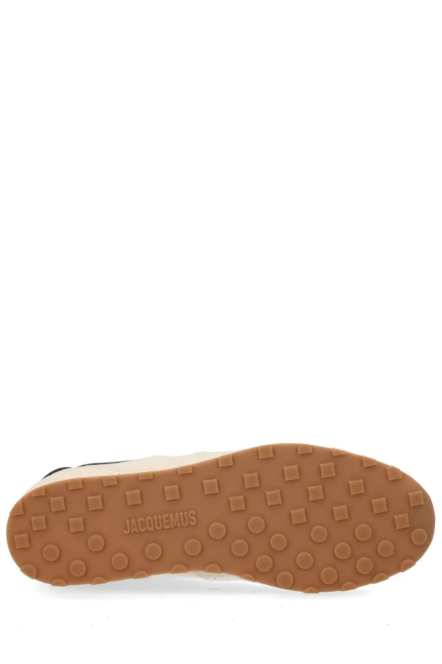 Tan rubber sole with square and circular grips embossed with jacquemus on jacquemus men’s les tennis sneaker beige