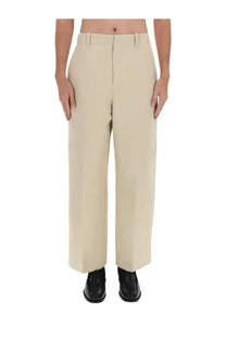 Beige jacquemus men’s wide-leg tailored trousers with subtle front pleats for a clean sophisticated look