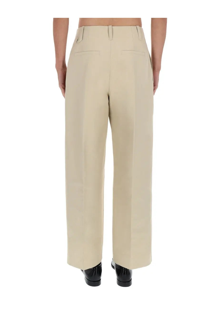 Jacquemus men’s beige wide-leg trousers with a clean tailored fit and subtle front pockets