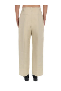 Jacquemus men’s beige wide-leg trousers with a clean tailored fit and subtle front pockets