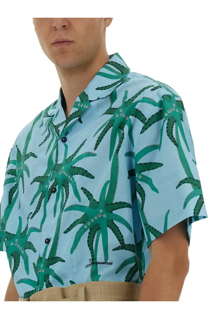 Jacquemus men’s light blue short-sleeved button-up shirt with vibrant green octopus pattern and sparkling embellishments