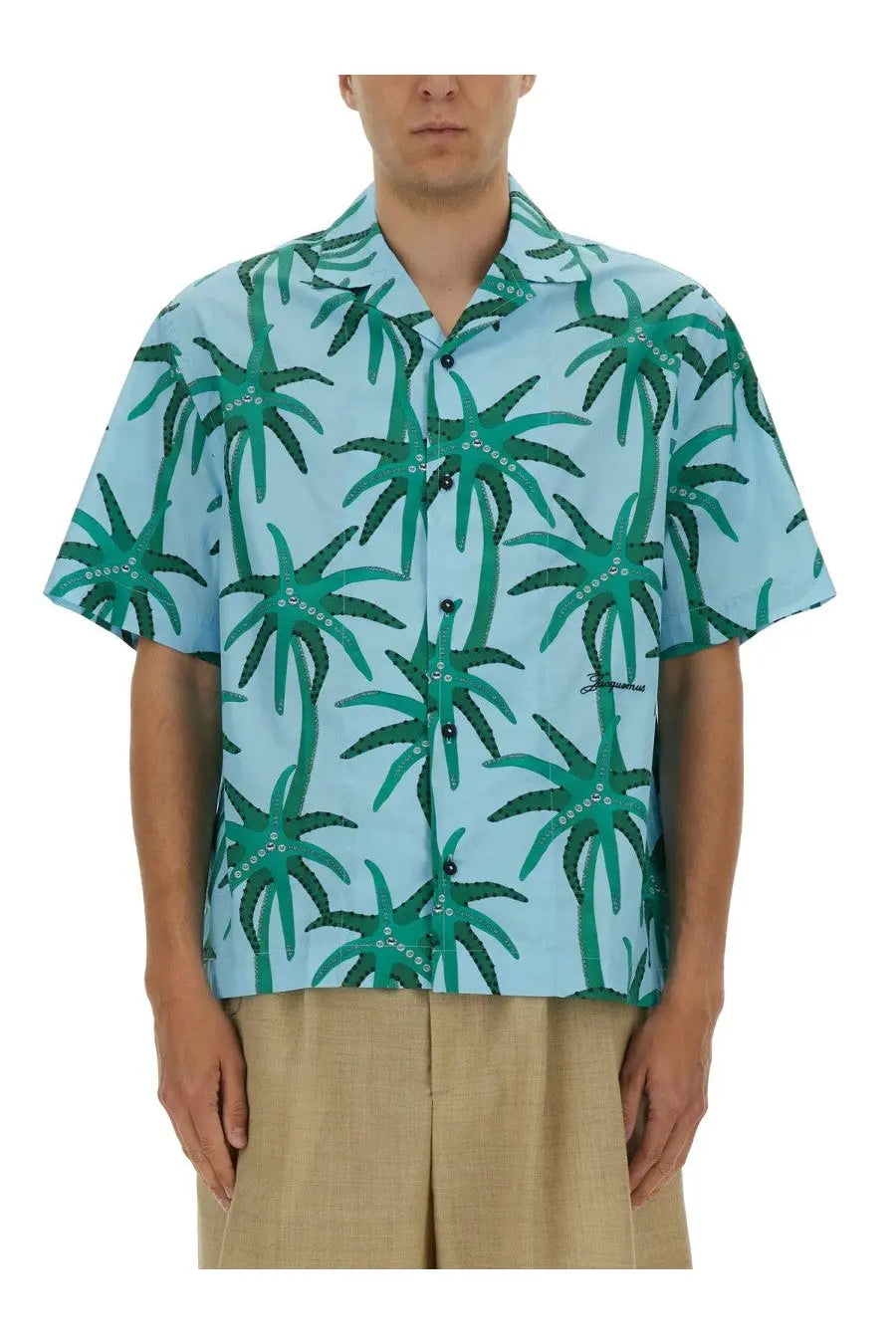 Jacquemus men’s short-sleeved button-up shirt in light blue with a vibrant green palm tree pattern