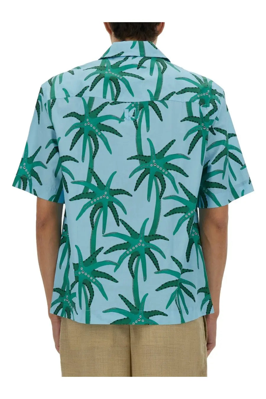 Jacquemus men’s light blue short-sleeved shirt with vibrant green palm tree pattern and white bead details on fronds