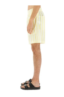 Jacquemus men’s short aloe beige cotton shorts with yellow and white vertical stripes and subtle logo on side pocket