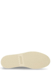 Cream-colored rubber sole with interlocking circles and squares pattern and sandaloft brand on brown jacquemus men’s sneaker back