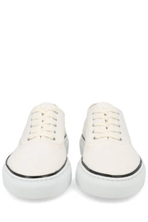 Jacquemus men’s white canvas sneakers with black rubber soles and silver eyelets for casual wear