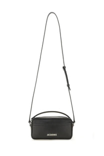 Black leather crossbody bag jacquemus with minimalist design and white embossed logo on front for unisex use