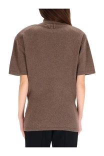 Brown textured short-sleeved jersey top with collar and back button detail by jacquemus in chestnut brown shown from back