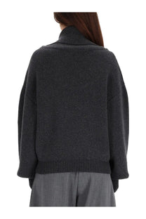Dark gray oversized knit sweater with ribbed turtleneck and cuffs from Jacquemus women’s jersey ball grey collection