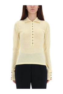 Jacquemus women’s yellow knitted polo shirt with long sleeves subtle sheen and dark metallic buttons down the front
