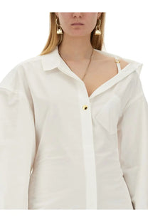 Jacquemus women’s white oversized button-up shirt mini dress with gold-tone hardware and relaxed draped silhouette