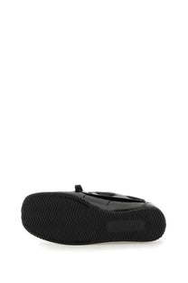 Jacquemus women’s Batto black moccasin slip-on with glossy black patent leather and textured rubber sole